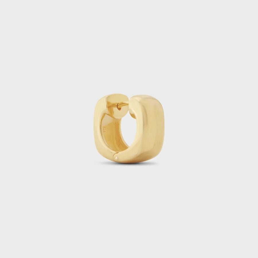The Solace Huggies in 18K gold or silver finish